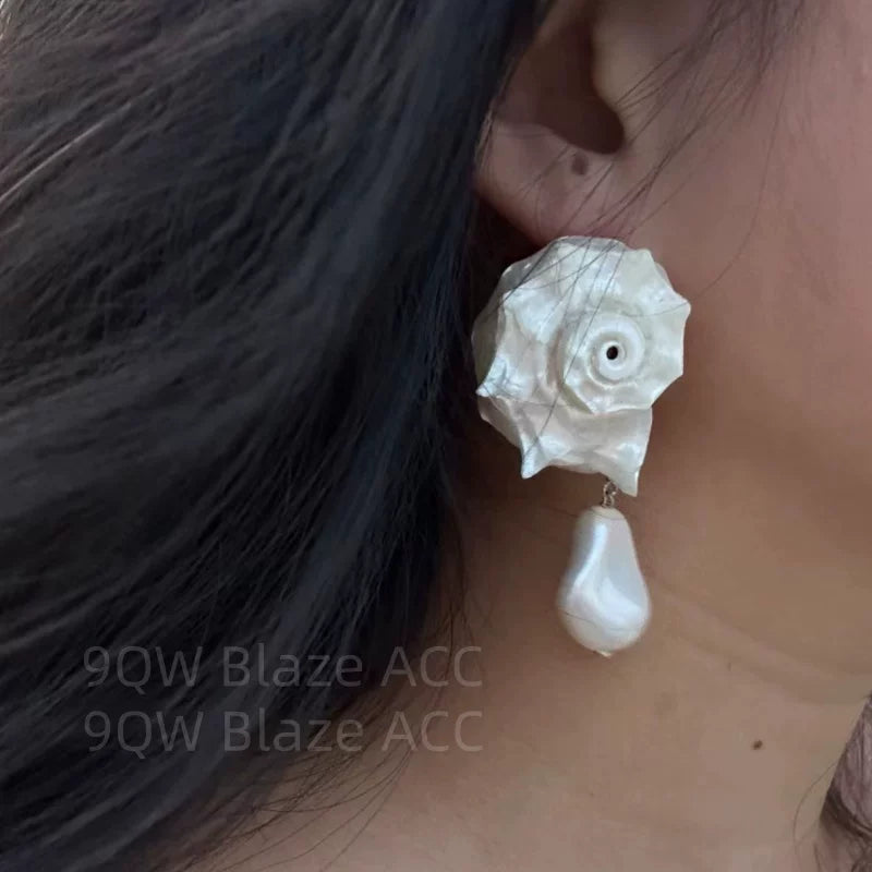 Light luxury artificial baroque natural shell stud earrings women's high-end three-dimensional niche shape earrings are elegant and temperamental
