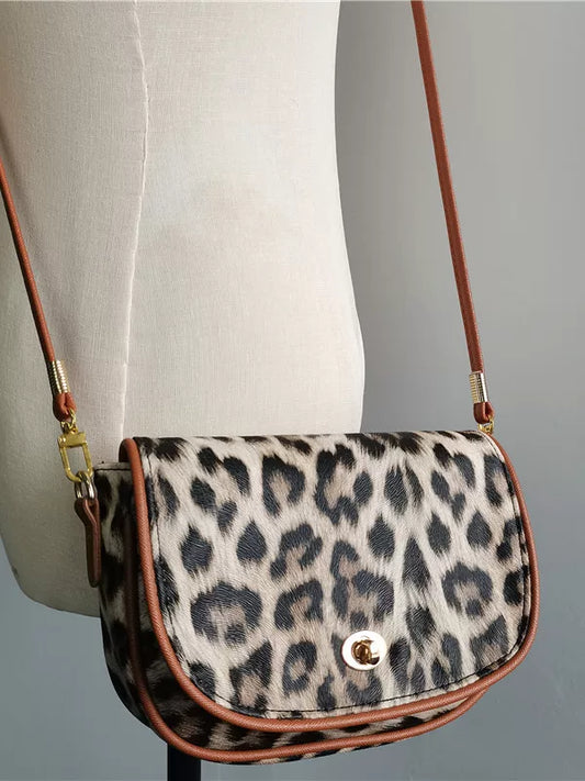 Crossbody bag women's bag 2026 new leopard print niche design shoulder bag armpit bag saddle packaging mobile phone coin purse