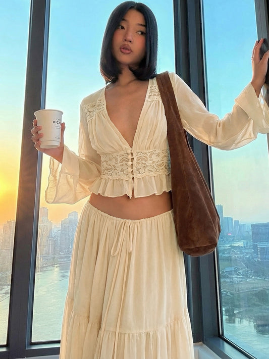 Resort-style long-sleeved V-neck top + flowing skirt long skirt two-piece Maldives heavy industry texture suit for women