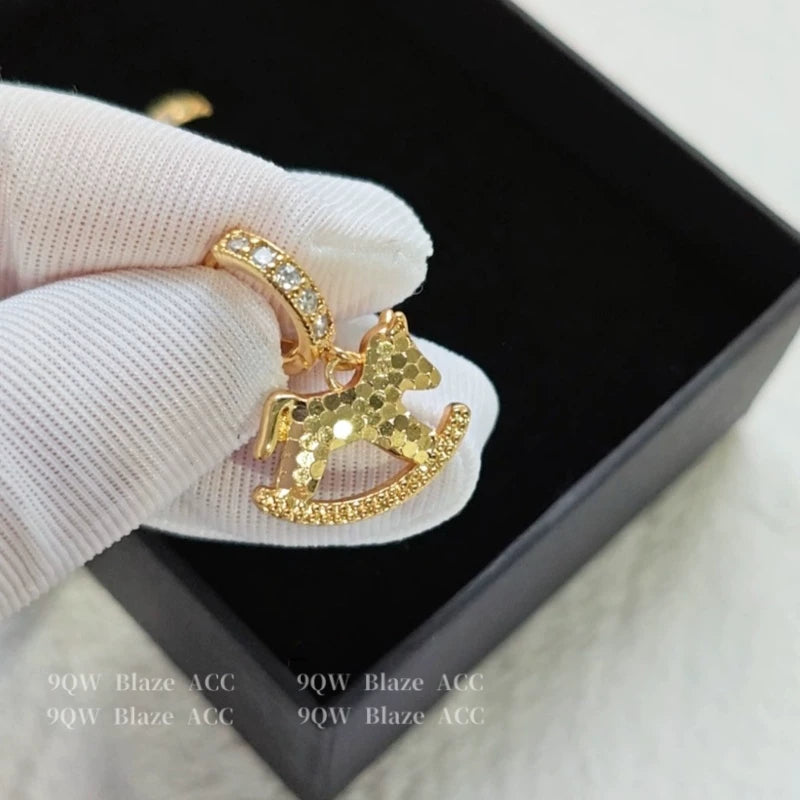 National tide light luxury niche design sense rocking horse earrings female brass diamond high-end earrings fashion temperament stud earrings