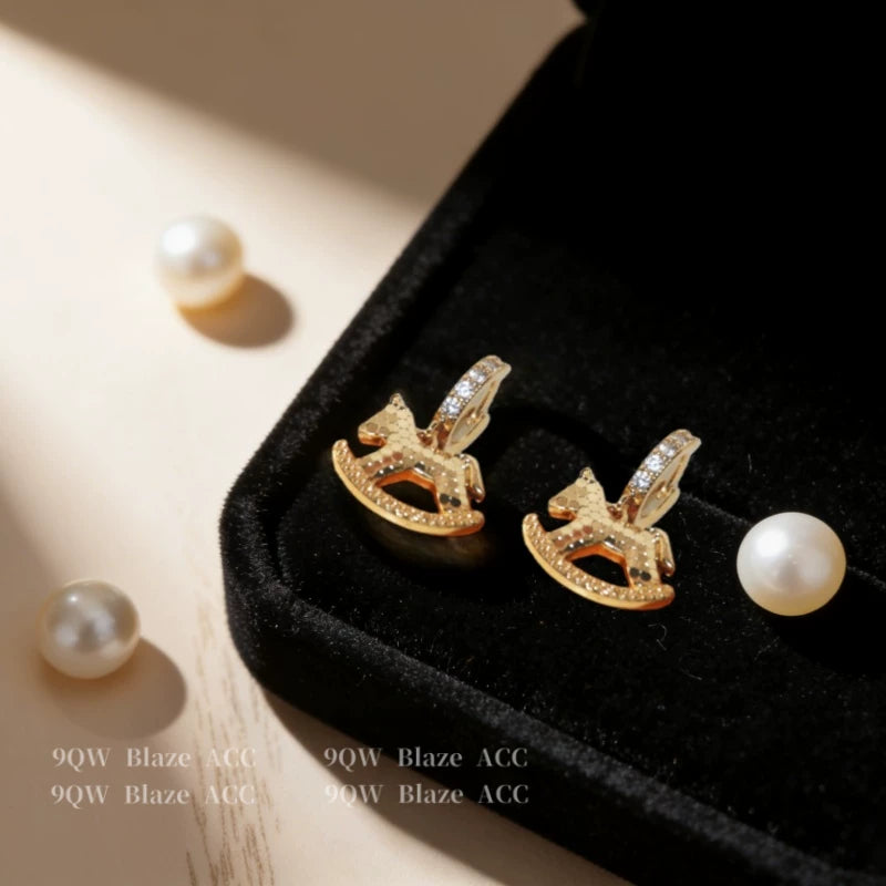 National tide light luxury niche design sense rocking horse earrings female brass diamond high-end earrings fashion temperament stud earrings